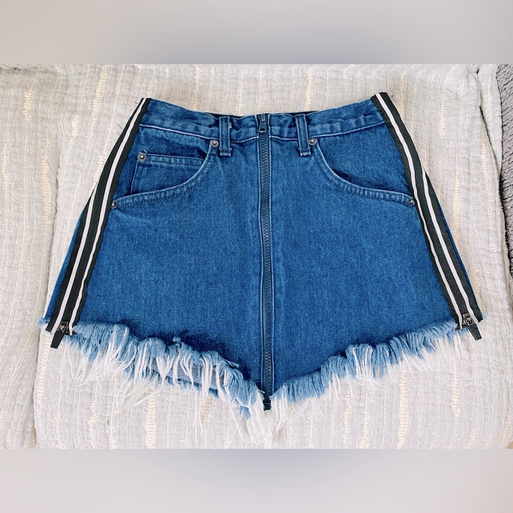 Carmar denim fringed mini skirt with side zipper accent and front zip closure